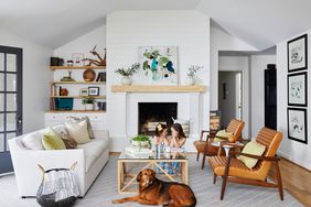 a-frame ceiling living room with dog and daughters