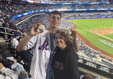 Long Island man with mom after catching two foul balls at Citi Field