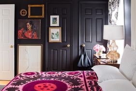 bedroom with black walls and doors