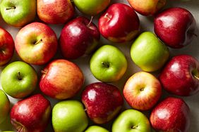 red and green apples on a table