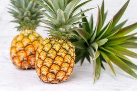 fresh whole pineapple on kitchen counter