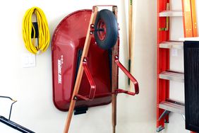 organized garden equipment in garage