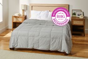 The Garnet Hill Essential Down Comforter fixed on a bed in a bedroom setting