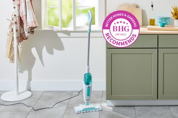 The Shark Steam Mop Hard Floor Cleaner S1000 placed in front of kitchen counter and window