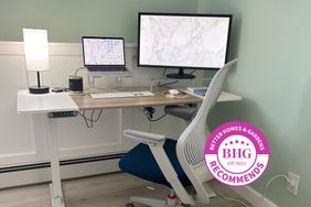 A computer and monitor on the Radlove Standing Desk in a room with an office chair