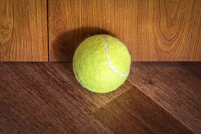 tennis ball on wood