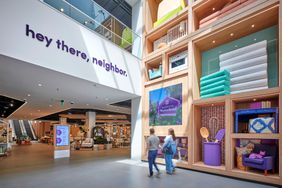 wayfair physical store warehouse interior with couple walking through