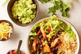 Burrito Bowls with bowls of cheese, guac, and pilo