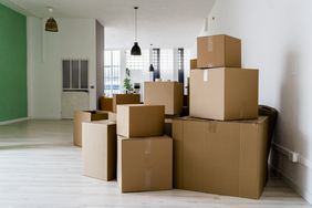 Carboard boxes in living room of new house