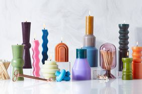 colorful candles on marble backdrop