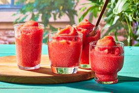 red drink water ice in four glasses