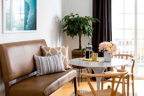 Dining area with bench and woven chairs