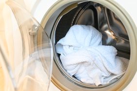 towels and bath mat washing in laundry machine