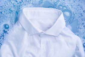 white shirt being hand washed to remove mascara