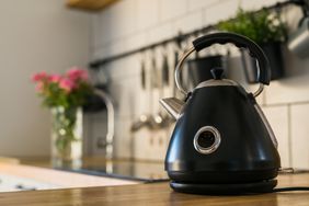 Vintage style black electric kettle on scandinavian kitchen