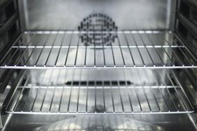 clean oven racks inside stainless steel oven