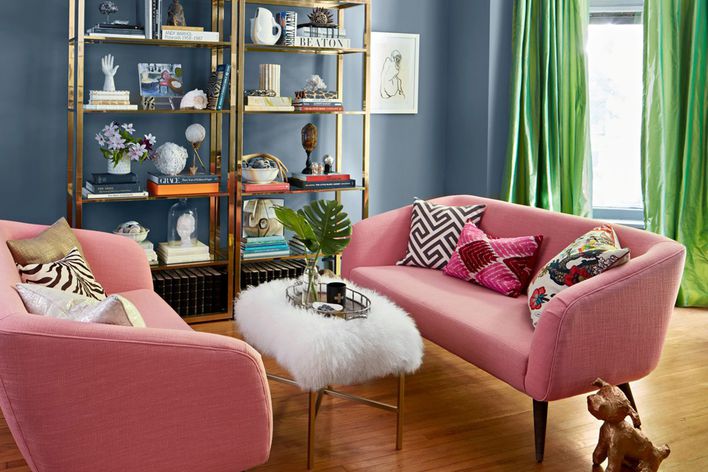 pink couches with green curtains