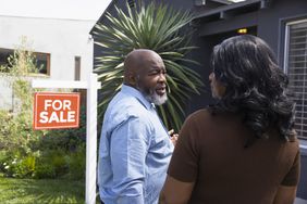 Mature couple looking at home for sale