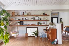 music room wood shelves piano plants