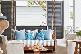 chairs and swinging daybed on porch