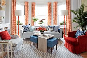 red white blue sitting room with large windows