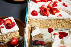 Homemade Tres Leches Cake with spatula in glass dish