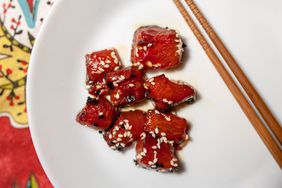 watermelon tuna pieces on plate with chopsticks