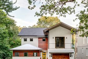 White wooden house garage yellow door