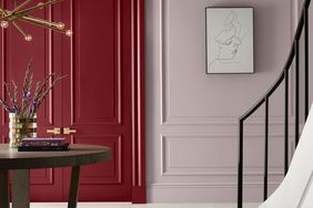 Double doors in an elegant interior painted in a carmine shade of red