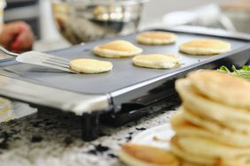 Woman Cooking Pancake Breakfast in a Home Kitchen